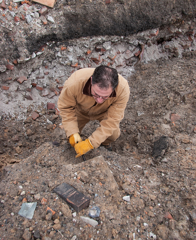 David retrieving artifacts. Image Copyright © David E. Sneed, All Rights Reserved